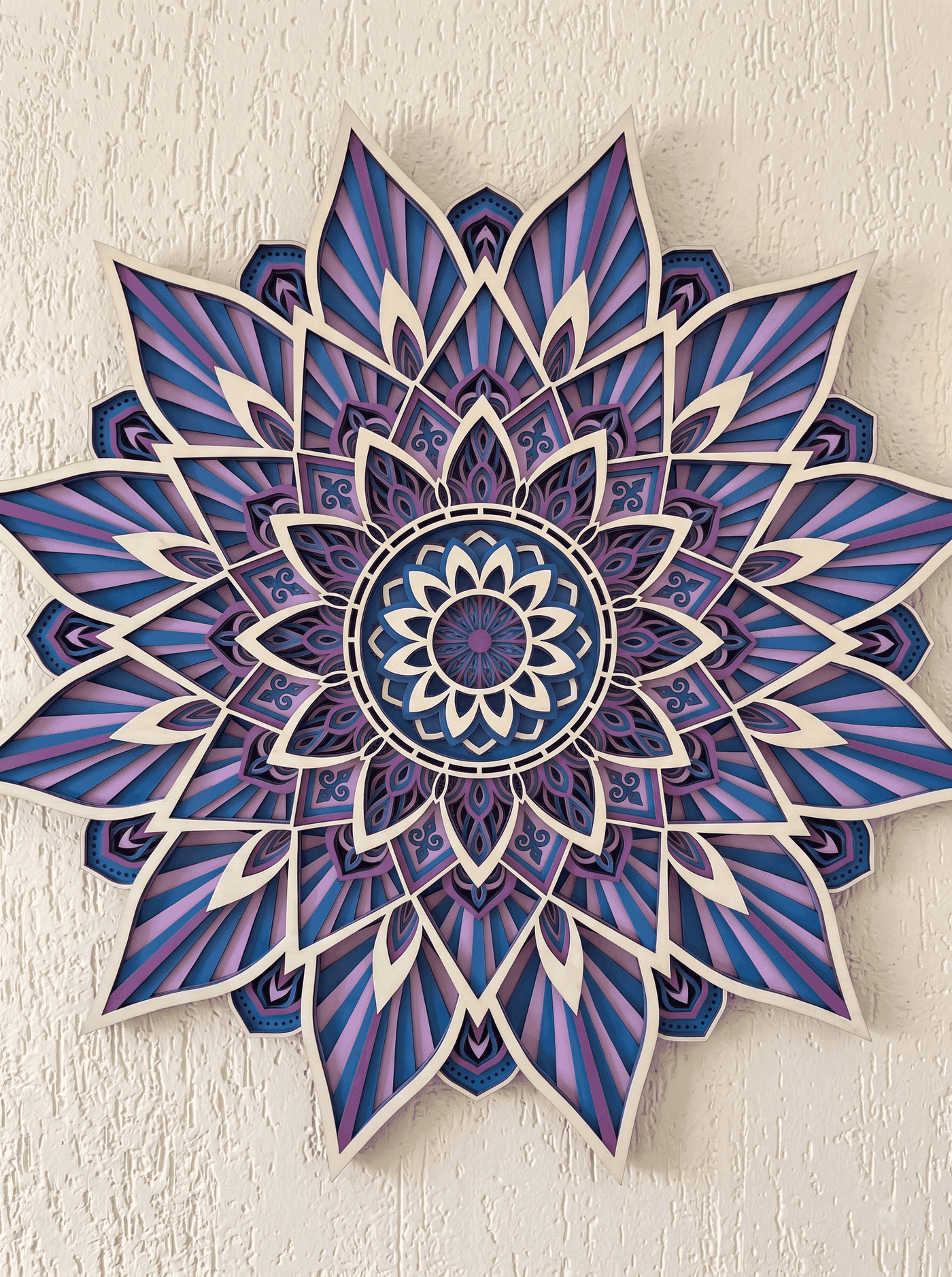 Handcrafted 9-Layer 3D Wooden Mandala Wall Art | Indigo & Amethyst Geometric Decor shown in a room
